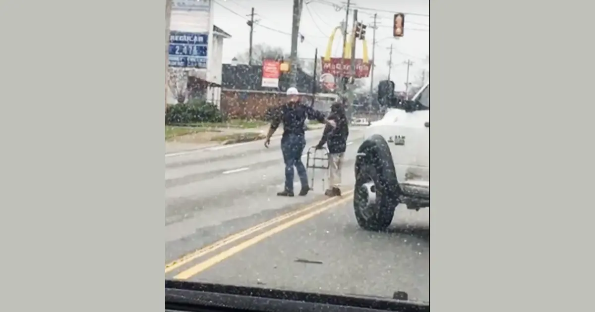 Kind man helps cross road