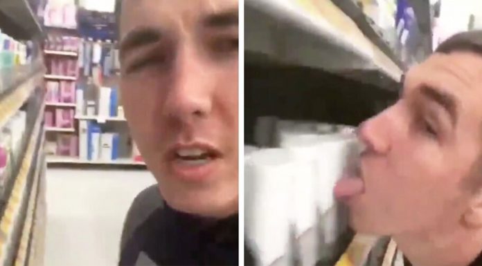 man licks walmart items