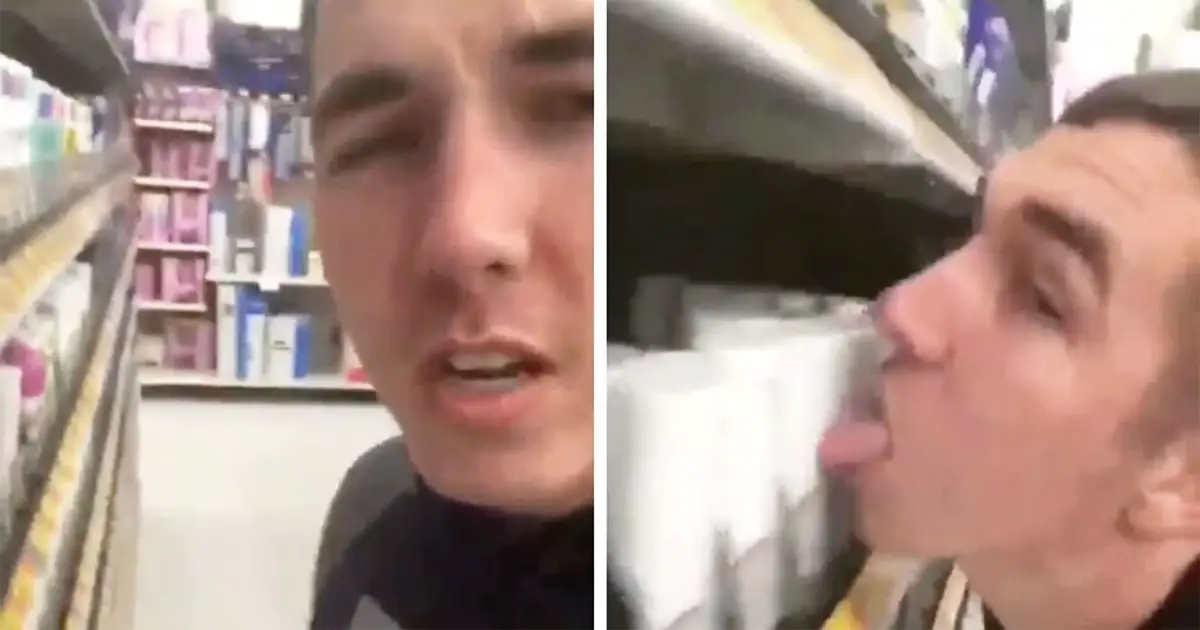 man licks walmart items