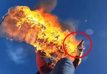 man-set own-parachute-on-fire