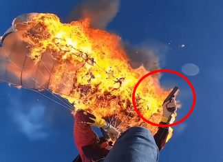 man-set own-parachute-on-fire