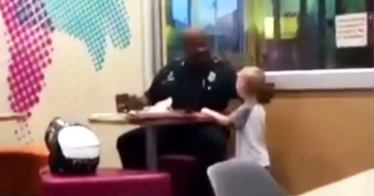 shy-toddler-suprises-officer