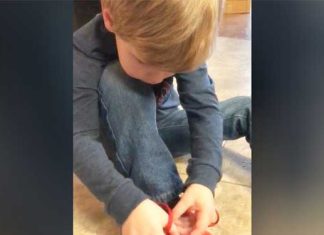 Young Boy Demonstrates Shoe Tying Trick