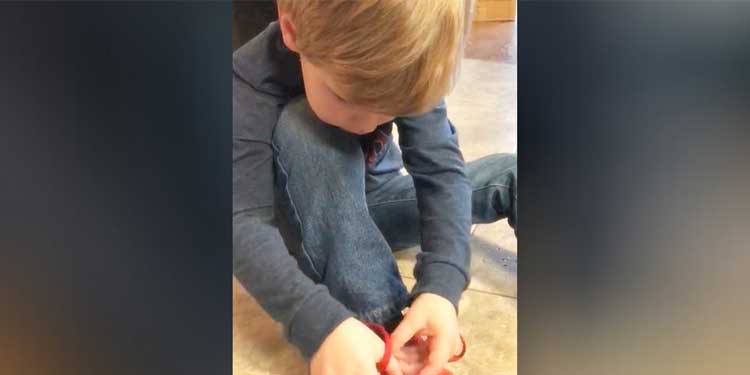 Young Boy Demonstrates Shoe Tying Trick