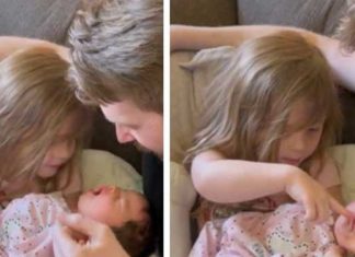 Little Girl Preciously Holds Newborn Sister