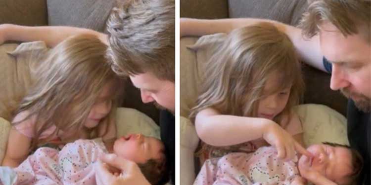 Little Girl Preciously Holds Newborn Sister